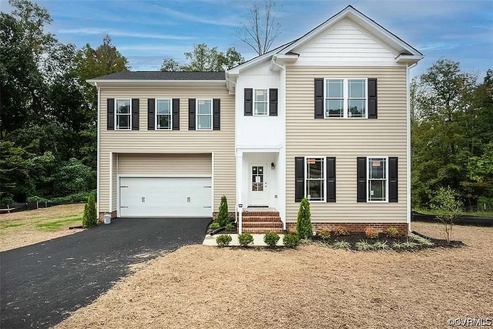 View of front of property featuring a garage