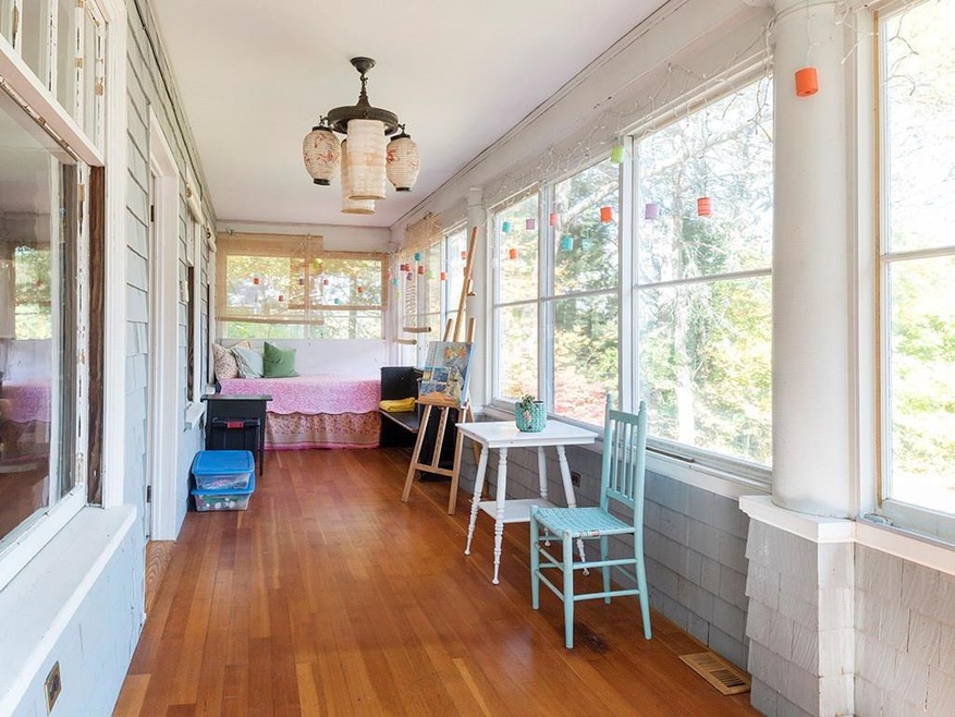 Sunlit porch with warm fir flooring