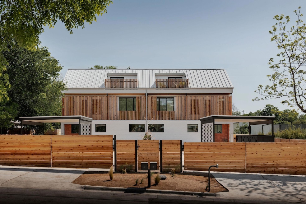 Contemporary house with a fenced front yard, meta