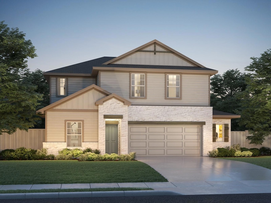 Craftsman house with stone siding, driveway, a ga