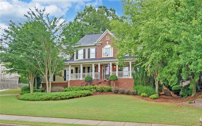 Stately Brick Front Home with Curved Stairs leadin