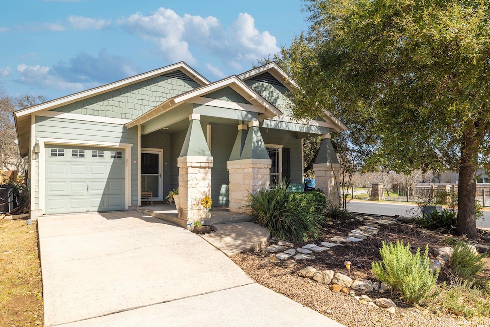 Craftsman-style home with driveway, an attached g