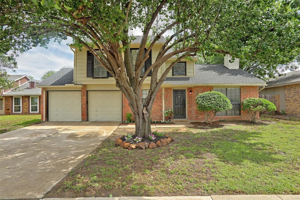 View of front of property featuring a garage and a