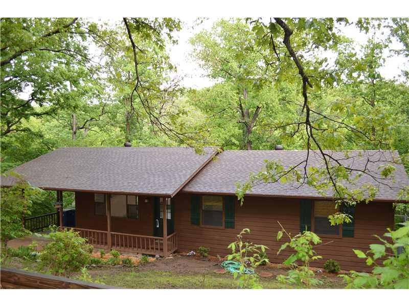 Exterior Front. Two generous lots provide serene privacy.