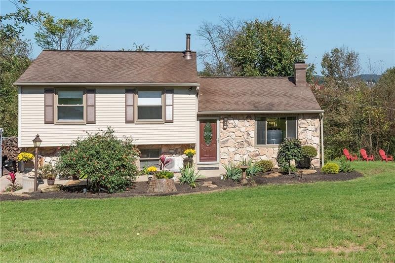 Beautiful curb appeal with enhanced landscaping, i