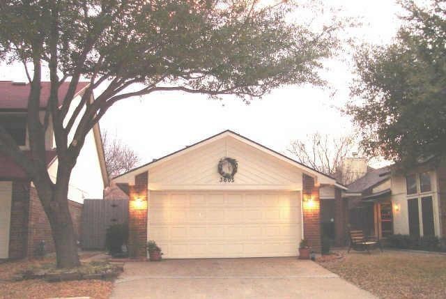 Ranch-style house featuring a garage