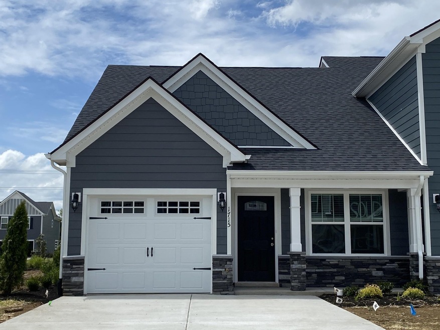 New Master Down & laundry on the 1st floor home w/2nd bedroom & loft upstairs, 2.5 baths, 1464 sq. ft., 1-Car Garage insulated, finished & trimmed, patio & privacy fence w/gate. 3 Warranties with Ole South  File photo of plan