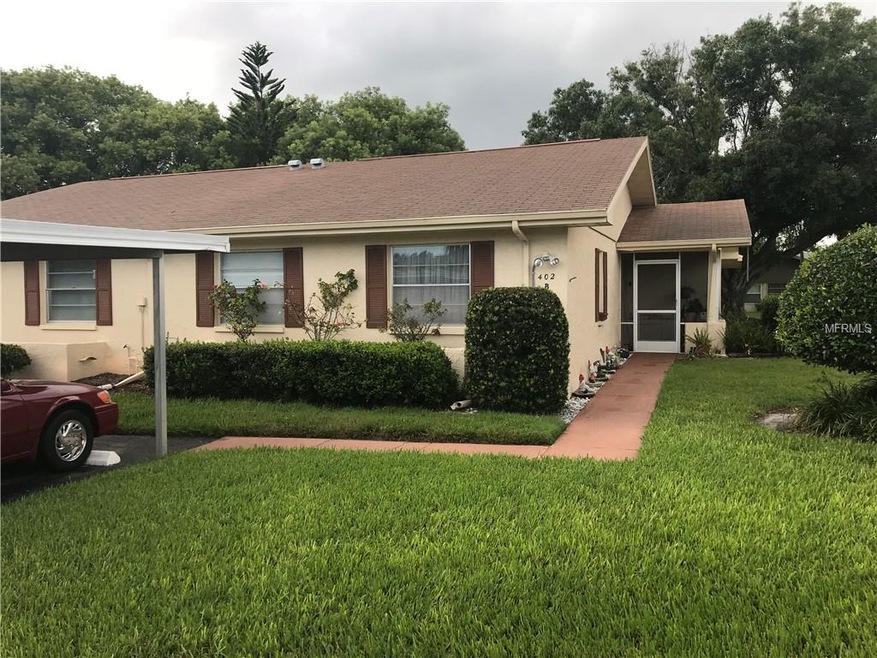 Exterior front including carport location.
