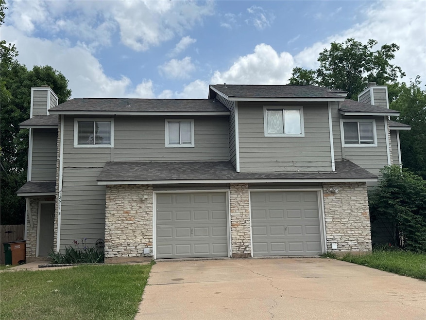 Multi unit property with stone siding, a chimney,