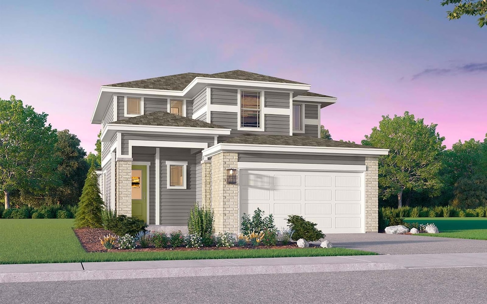 View of front facade featuring driveway and an at