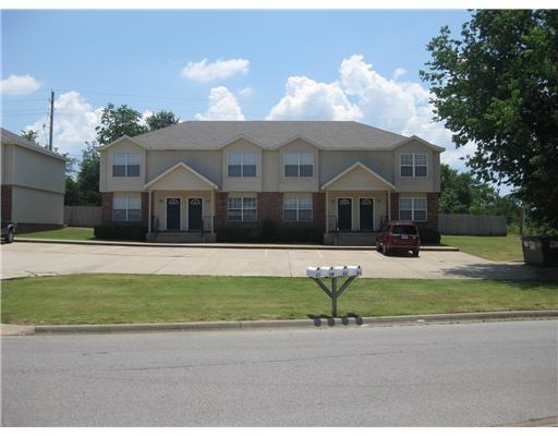 Exterior Front. Two beautiful two-story brick and vinyl 4-plexes, plenty of parking and convenient to everywhere!