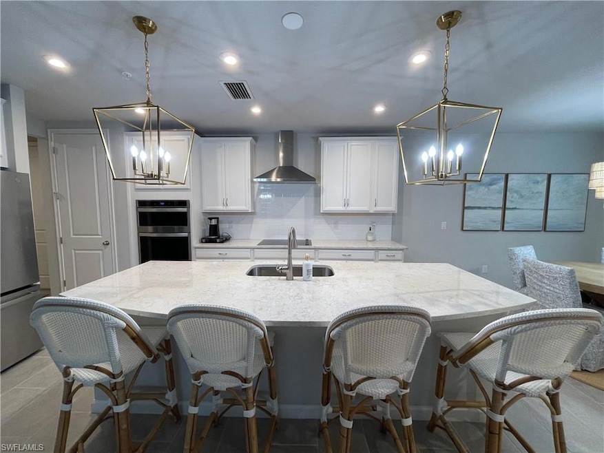 Kitchen featuring appliances with stainless steel 