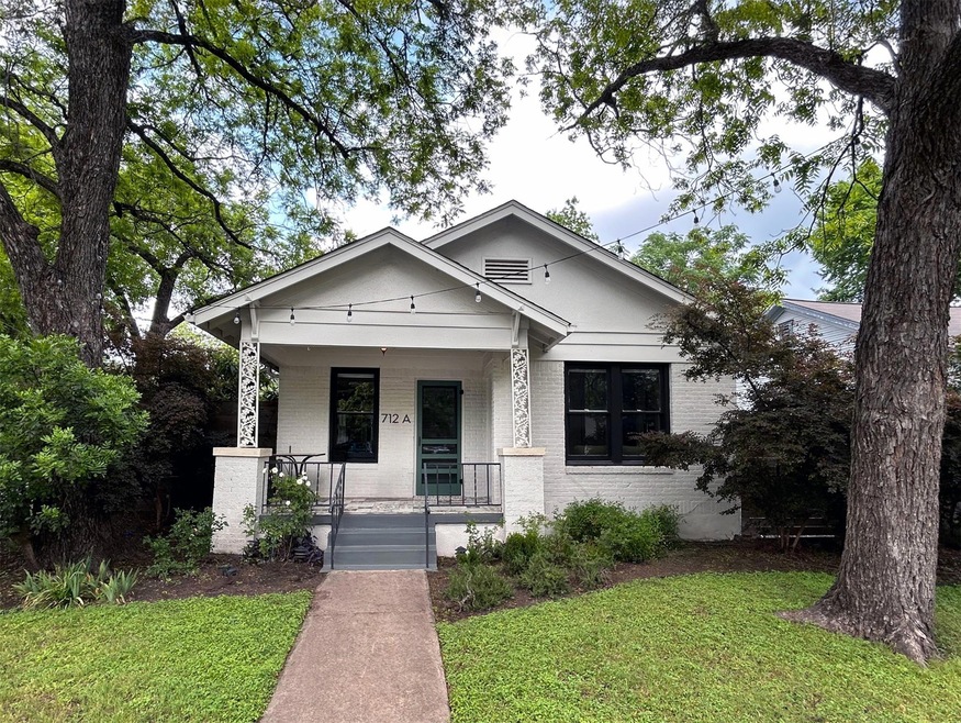 Bungalow-style home with a front lawn, brick sidi