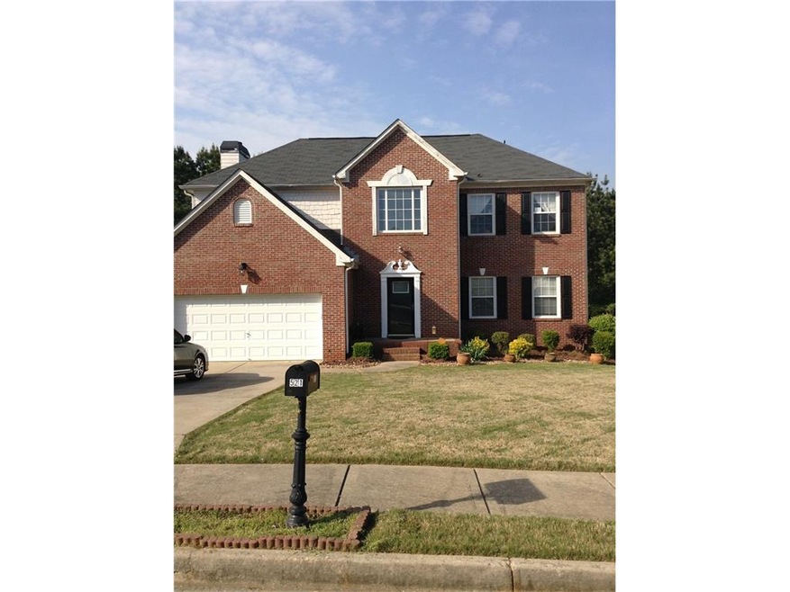 Exterior front brick and hardi plank , level drive