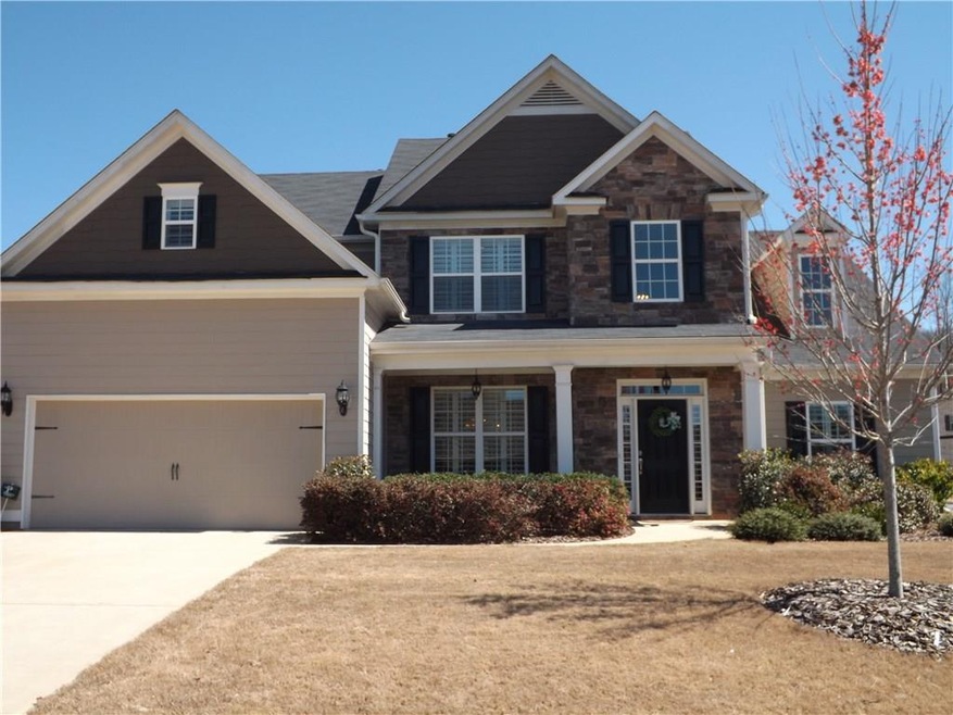 This idyllic home sits on a large level lot and is