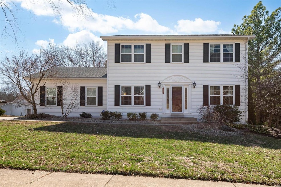 Colonial house with a front yard