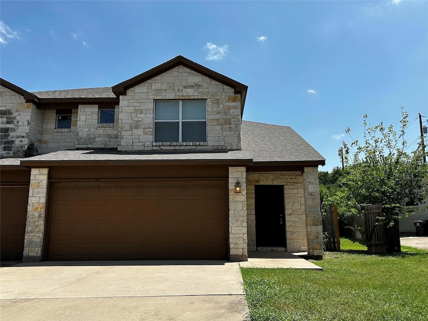 View of front facade with stone siding and concre