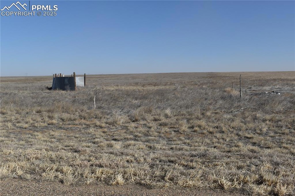 View of yard with central AC and a rural view