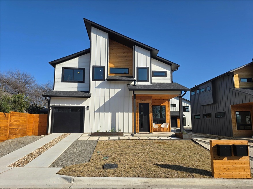 Contemporary home featuring a shingled roof, boar