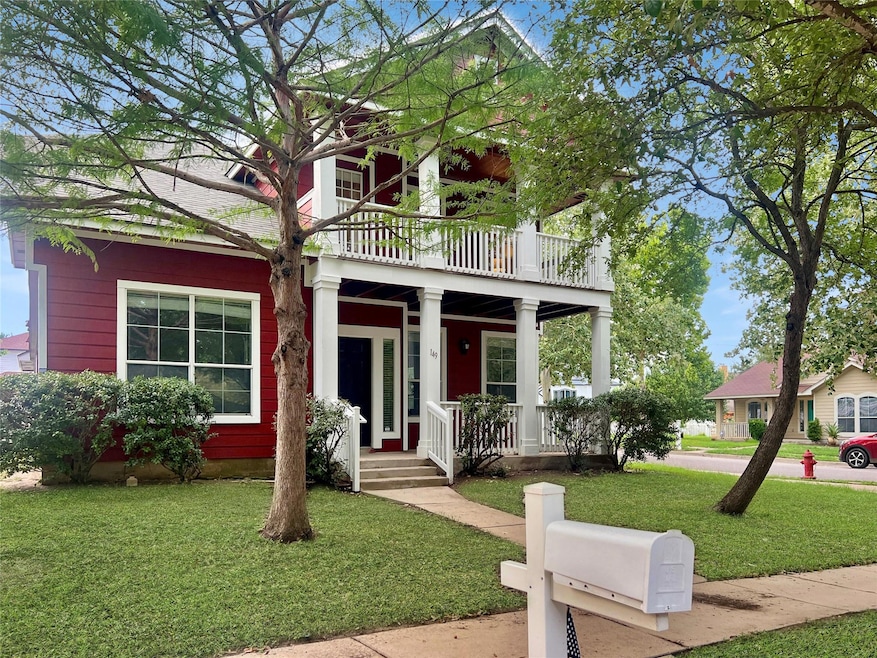 View of front of property featuring a balcony, a 