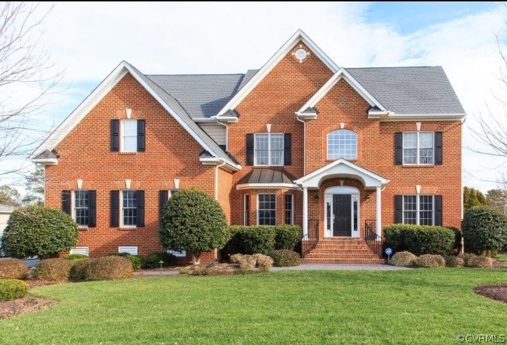 THIS HOME HAS IT ALL!!Brick front home on private