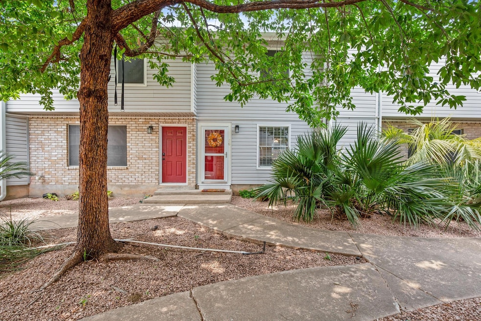 Townhome / multi-family property with brick siding