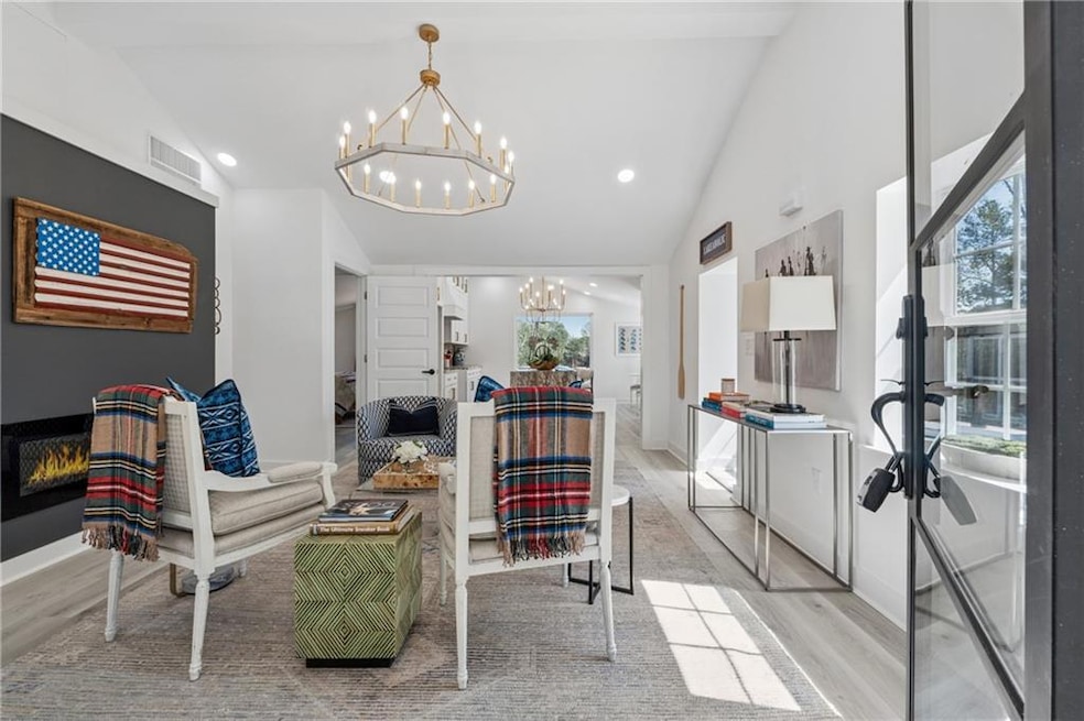 Living area with light wood-type flooring, a notab
