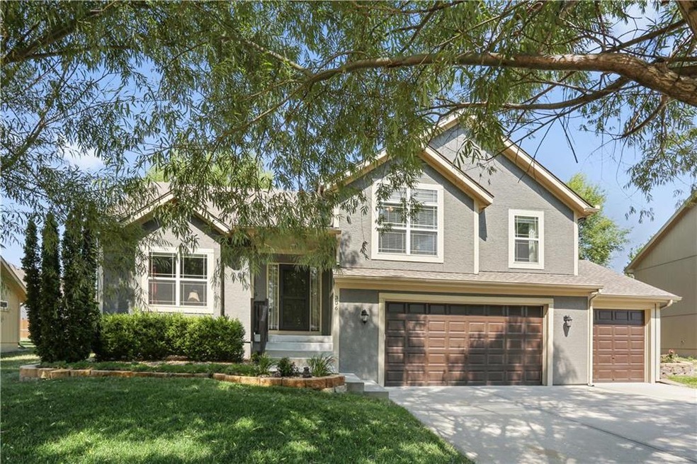 306 Eagle Glen Dr, Raymore, MO 64083 - photo 1