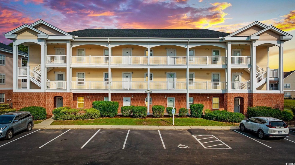 Property at dusk with uncovered parking and stairway