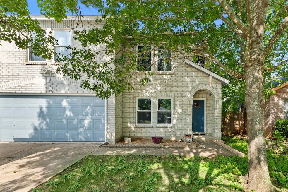 View of front of property featuring concrete driv