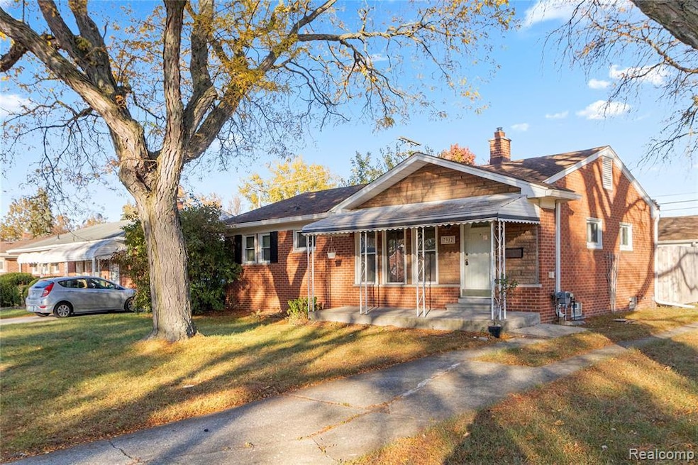 Bungalow-style house with brick siding, a porch, a chimney, a front lawn, and roof with shingles