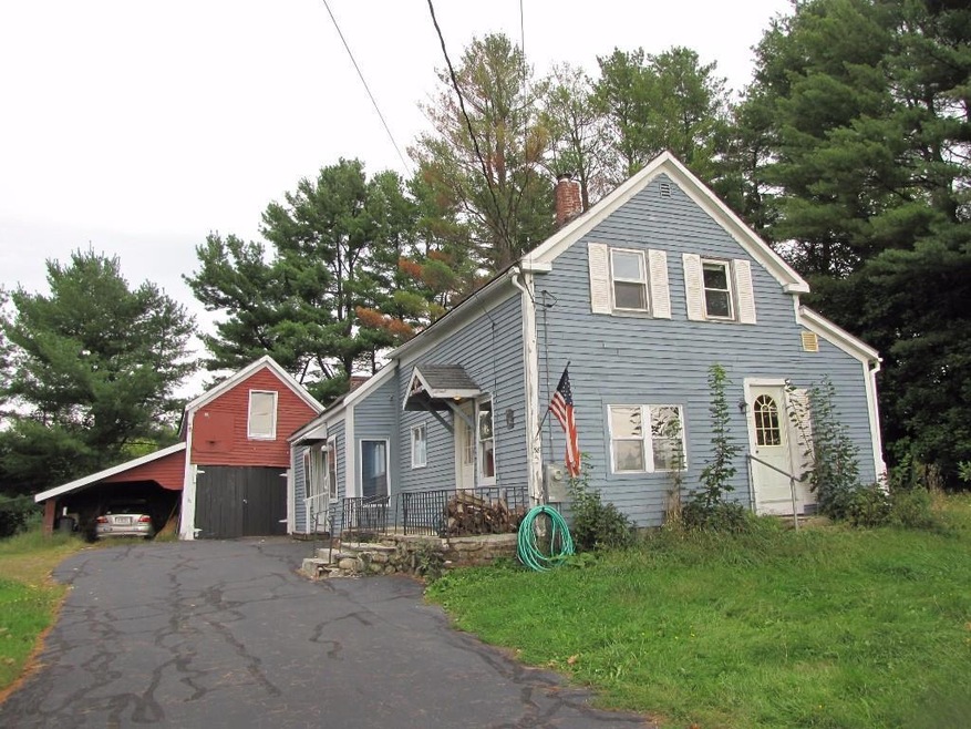 Front of home with attached barn and...