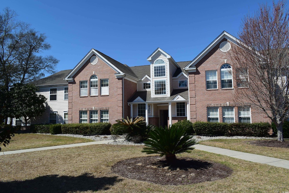 View of front facade featuring brick siding and a 