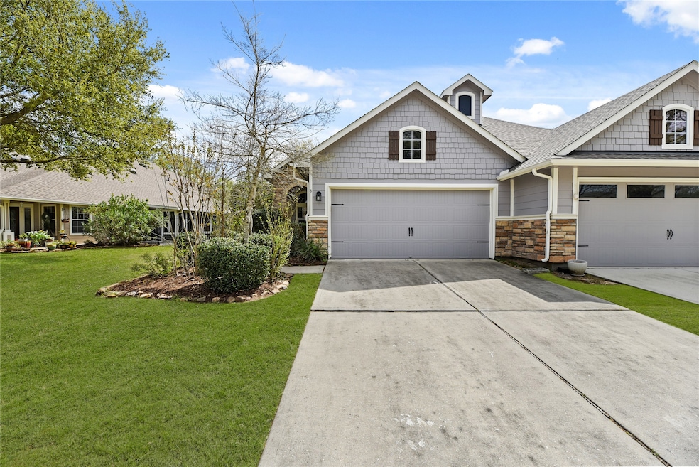 Charming home with great curb appeal, featuring a spacious driveway and lush landscaping. Perfect for creating lasting memories