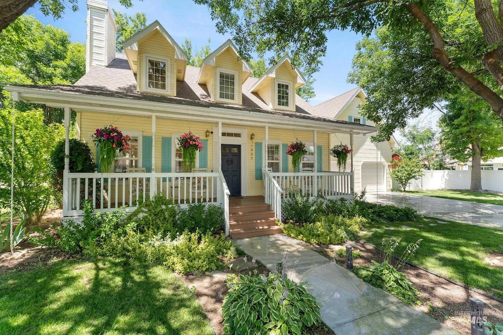 View of front of house featuring covered porch, a chimney, driveway, and a shingled roof