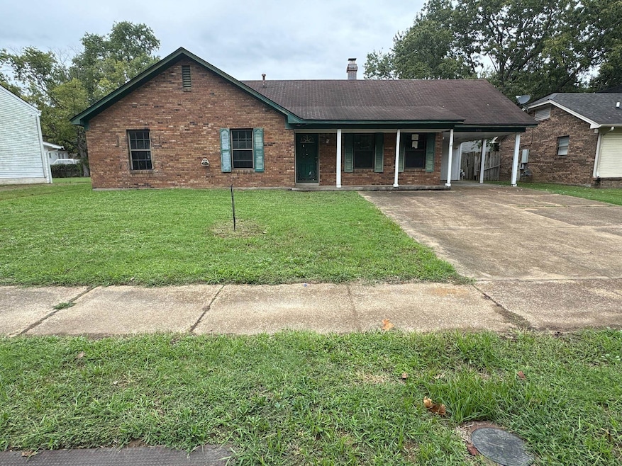 Single story home featuring a carport and a front 