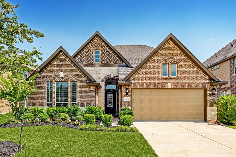 Beautiful home with amazing curb appeal. Gorgeous brickwork and well maintained mature landscaping.