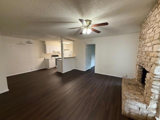 Unfurnished living room featuring a ceiling fan, 