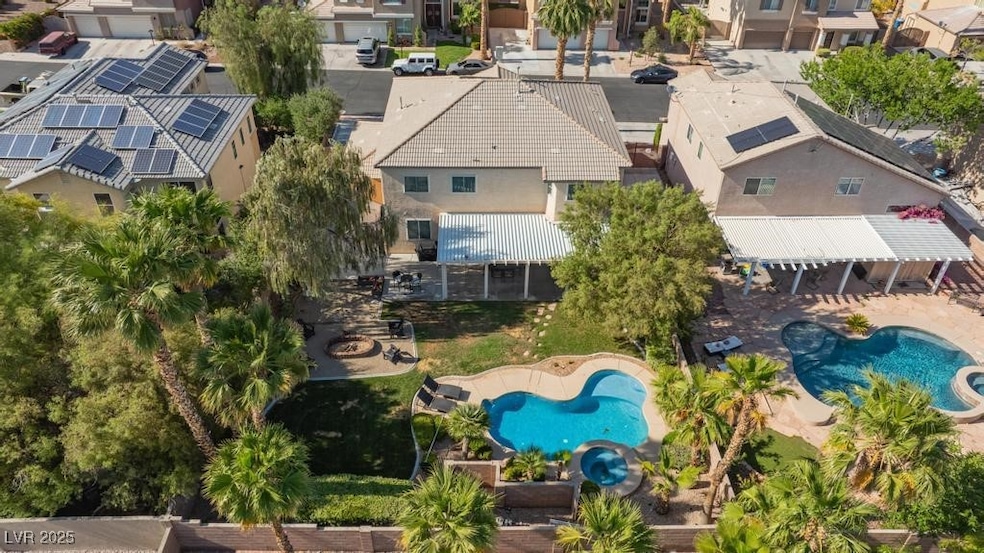 Aerial perspective of suburban area with a pool