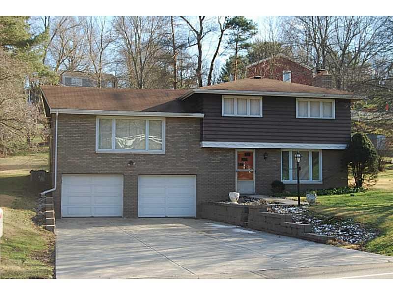 Exterior Front. Multi-level, new cement driveway