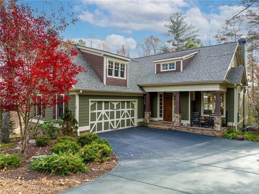 Meticulous Craftsman Cottage in one of Big Canoe's most popular neighborhoods within walking distance to Clubhouse and near all amenities.