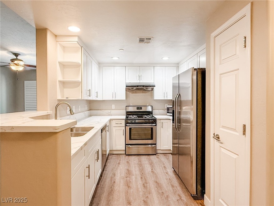 Kitchen with brand new cabinets and stainless steel appliances,