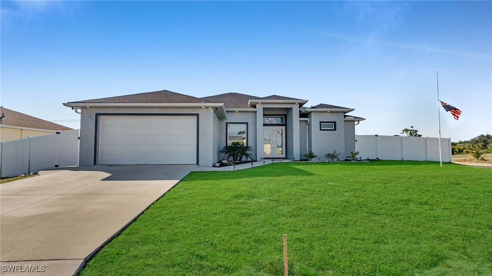 View of front of home featuring a garage and a fro