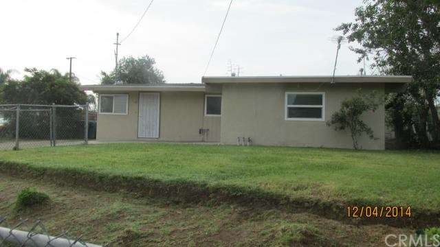 Front yard with automatic sprinklers. View from th