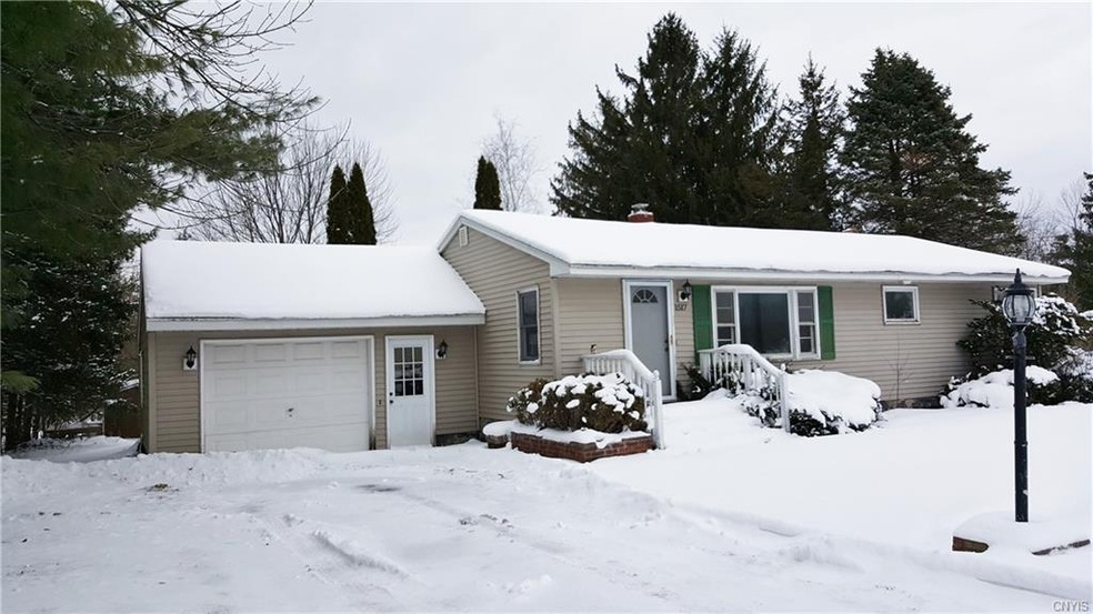 Pretty Ranch with vinyl siding, cement front steps
