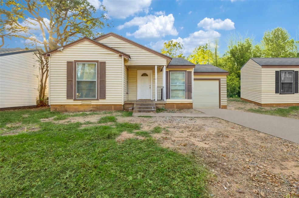 View of front facade featuring concrete driveway