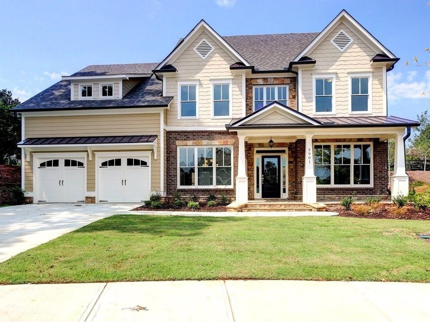 Elegant Stone, Brick, Shake exterior w/welcoming f