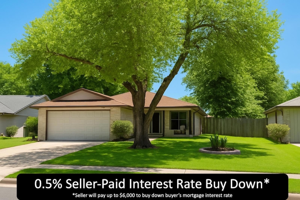 View of front of property featuring an attached g