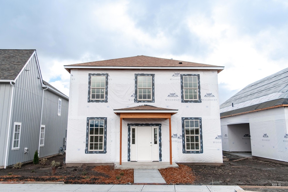 View of front of house featuring roof with shingles and stucco siding