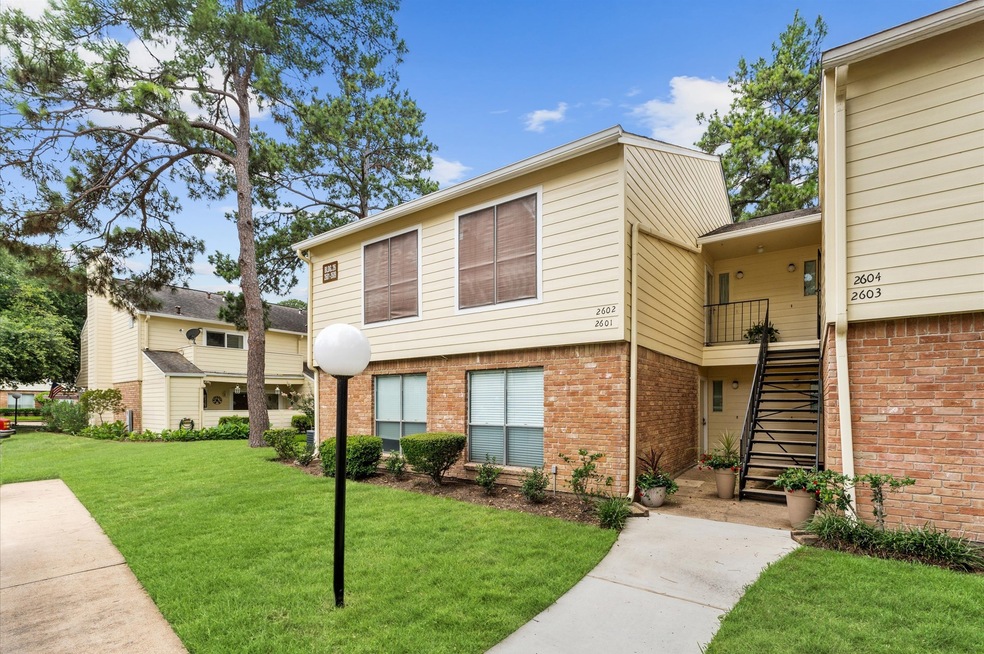 This photo shows a charming townhouse with a mix o